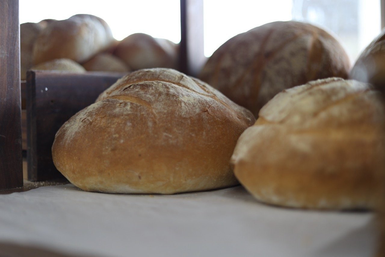 Round artisanal loaves on the EuroDeli bakery counter
