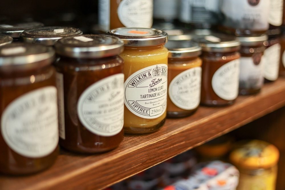 Preserves lined up on the grocery shelf
