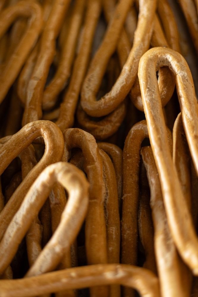 Golden baked rings cooling in the bakery